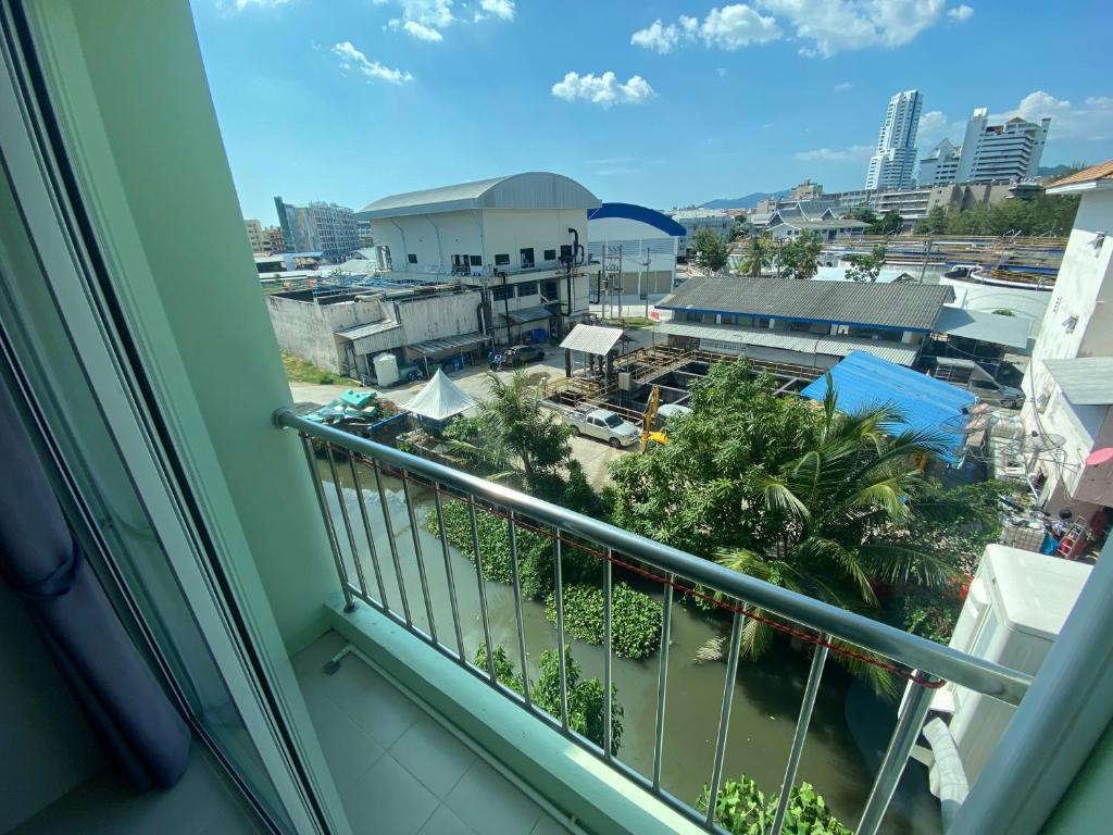 een balkon met uitzicht op een stad bij ZEN Hotel Patong Beach -ex- miami Production in Patong Beach