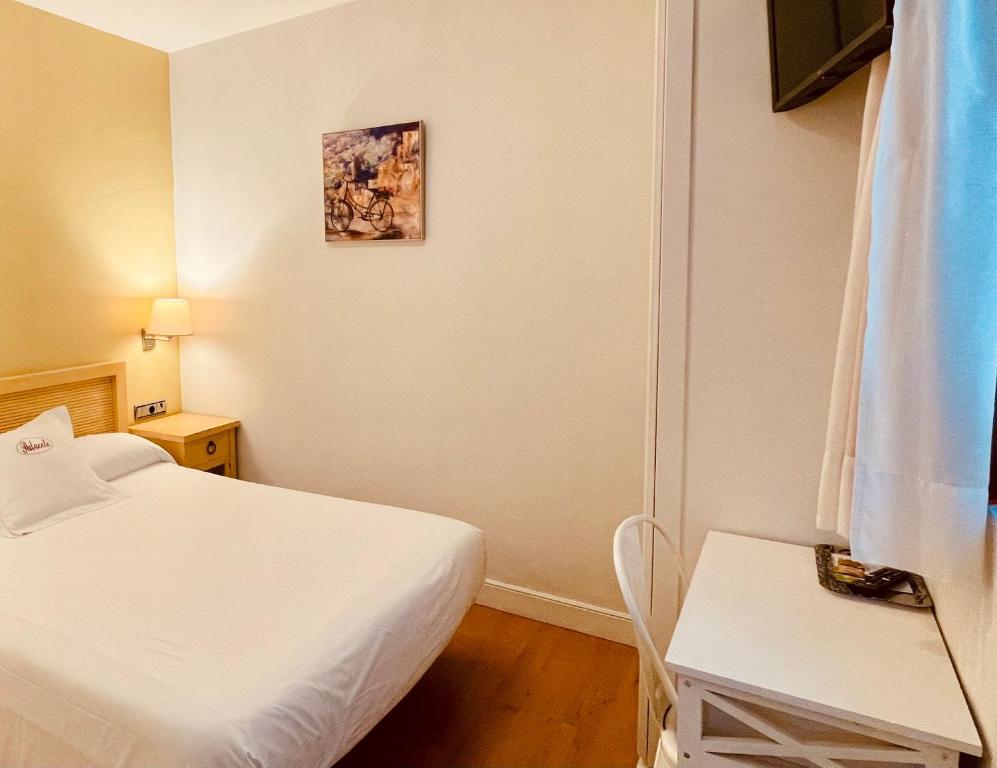 Postel nebo postele na pokoji v ubytování Hotel Palacete