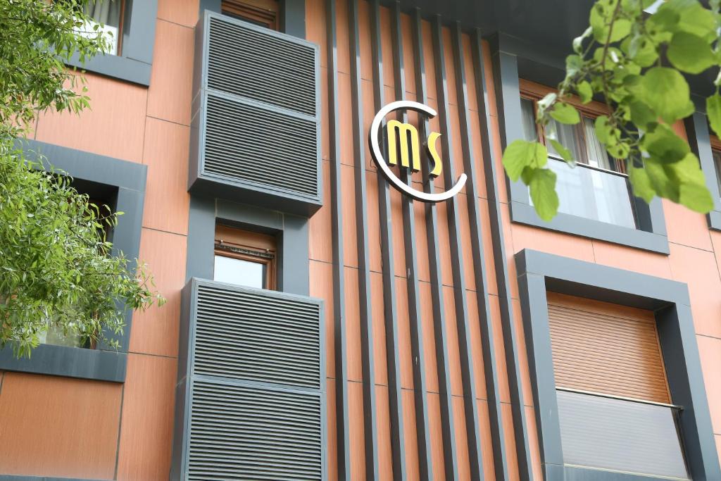 a building with a nmc sign on the side of it at Maidos suites in Eceabat