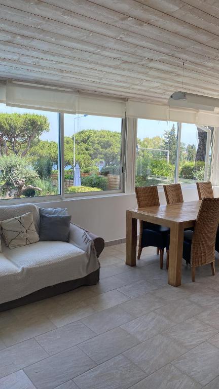 a living room with a couch and a table at Hotel Villa Maya in Saint-Tropez