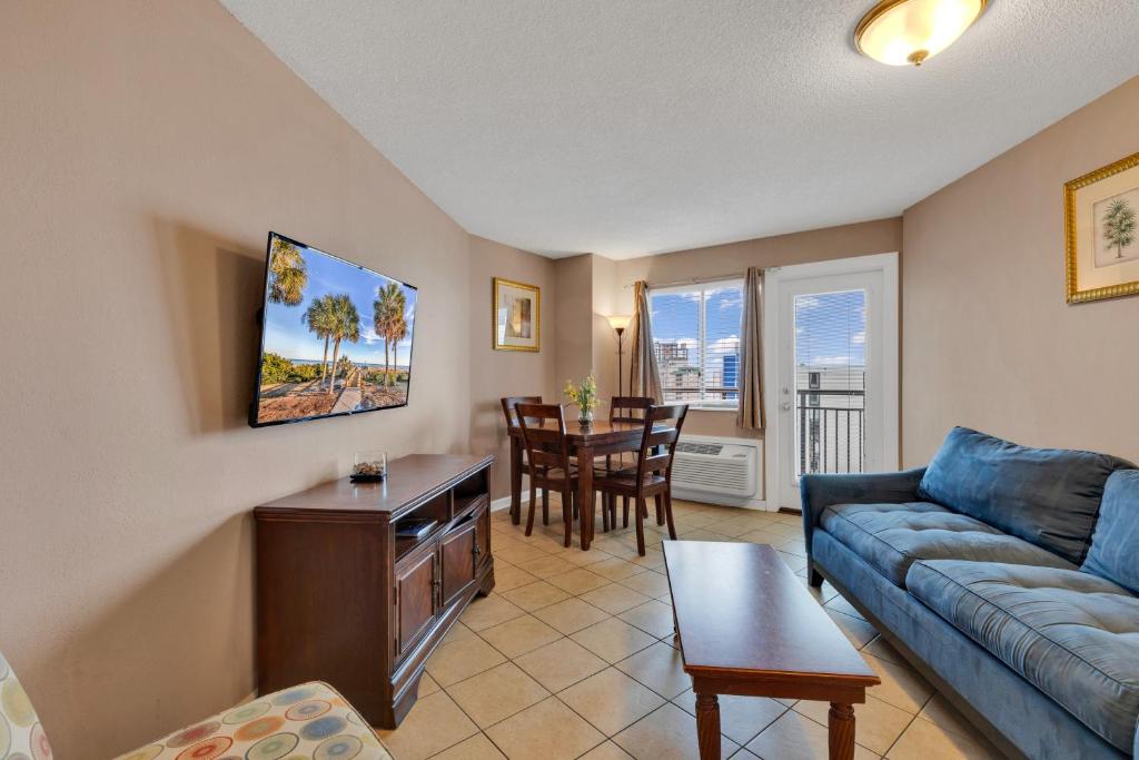 a living room with a couch and a table at Ocean View 1BR Condo in Myrtle Beach