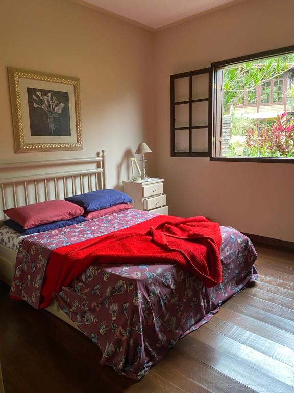 Cama ou camas em um quarto em Refúgio Tranquilo na Natureza com Casa de Festas: Perfeito para Família e Amigos