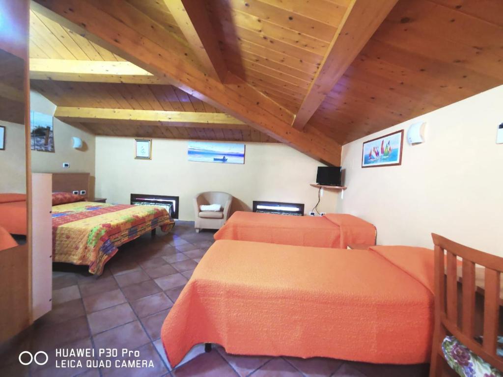 Postel nebo postele na pokoji v ubytování Porto Recanati Zimmer