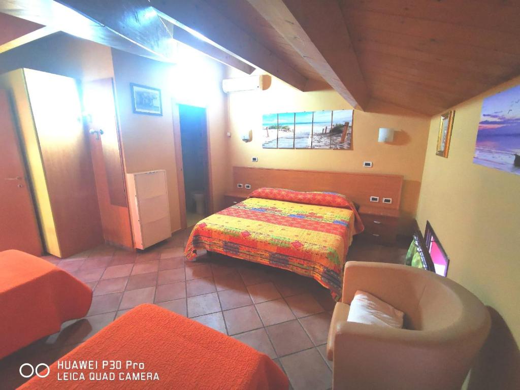 Postel nebo postele na pokoji v ubytování Porto Recanati Zimmer