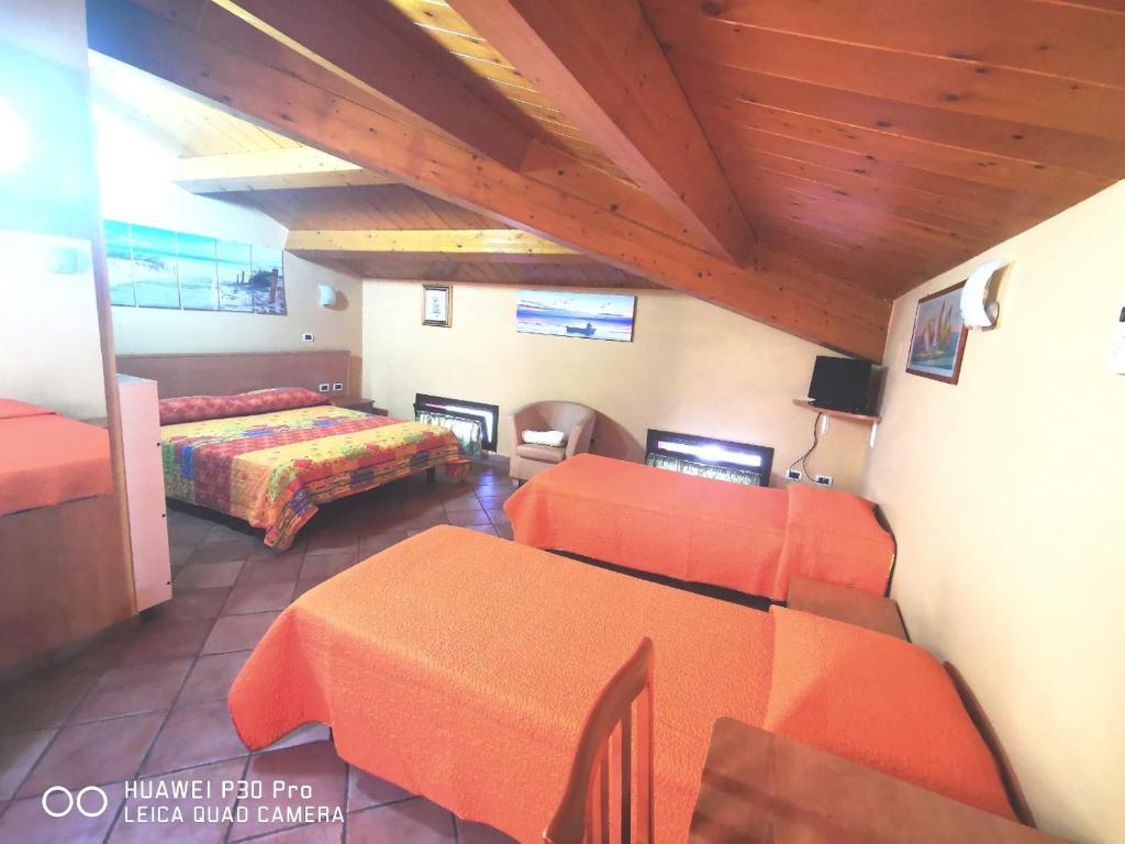 Postel nebo postele na pokoji v ubytování Porto Recanati Zimmer