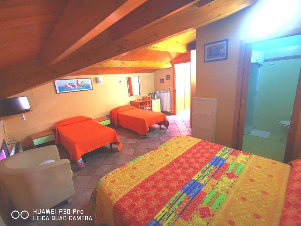 Postel nebo postele na pokoji v ubytování Porto Recanati Zimmer