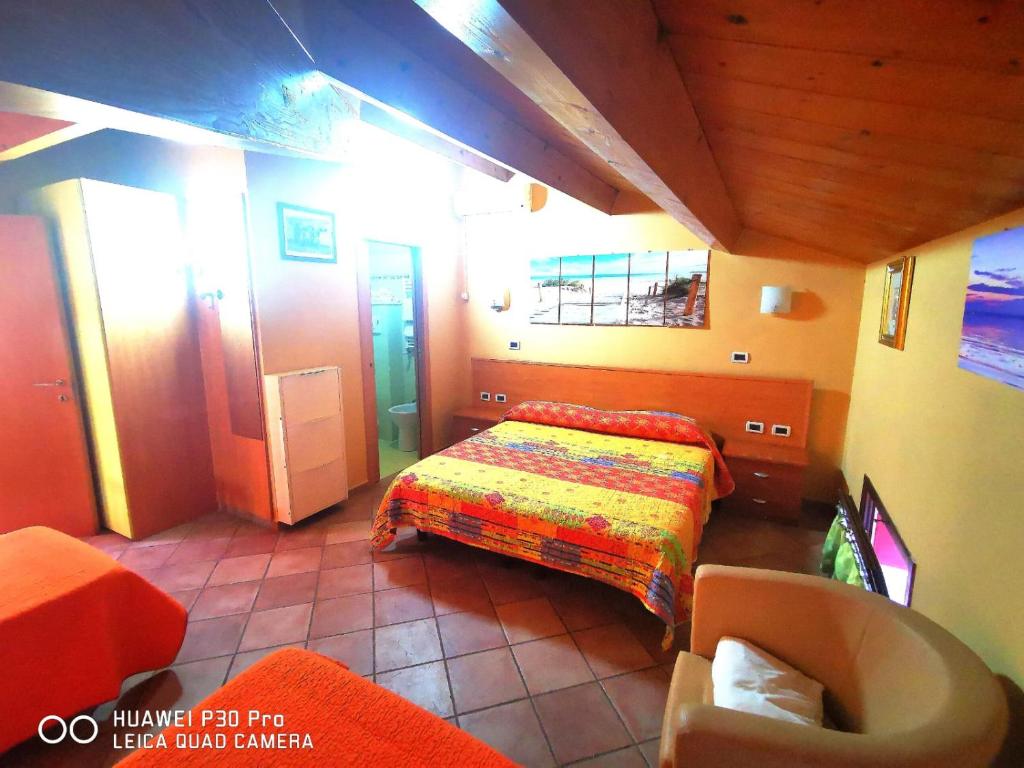 Postel nebo postele na pokoji v ubytování Porto Recanati Zimmer