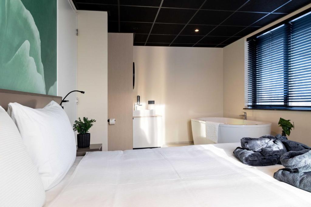 Postel nebo postele na pokoji v ubytování Hotel Waterstate