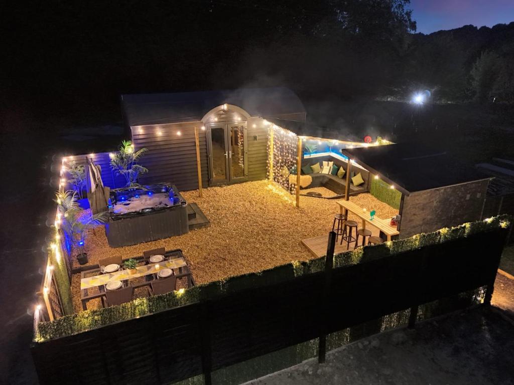 an aerial view of a house at night with lights at The Lodge at The Outside Inn in Mountfield