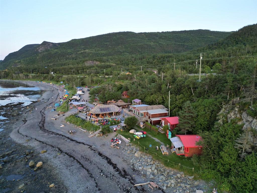 an aerial view of a resort next to a river at Auberge Festive Sea Shack in Sainte-Anne-des-Monts