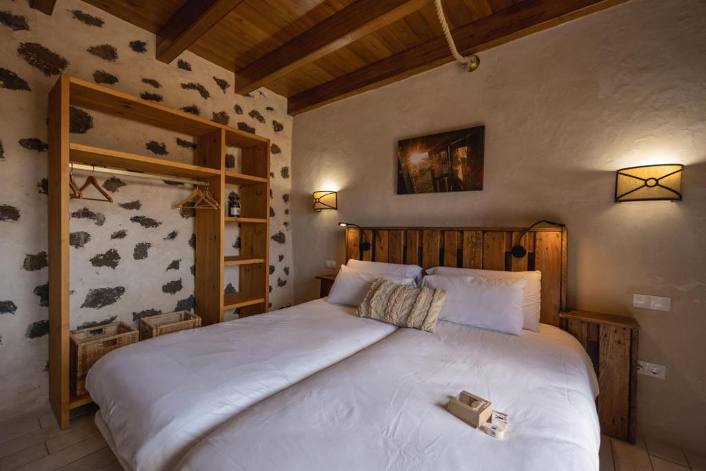 Postel nebo postele na pokoji v ubytování Hotel Rural El Cabo