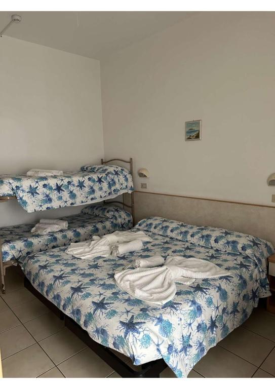 Postel nebo postele na pokoji v ubytování Hotel Vienna Rivazzurra