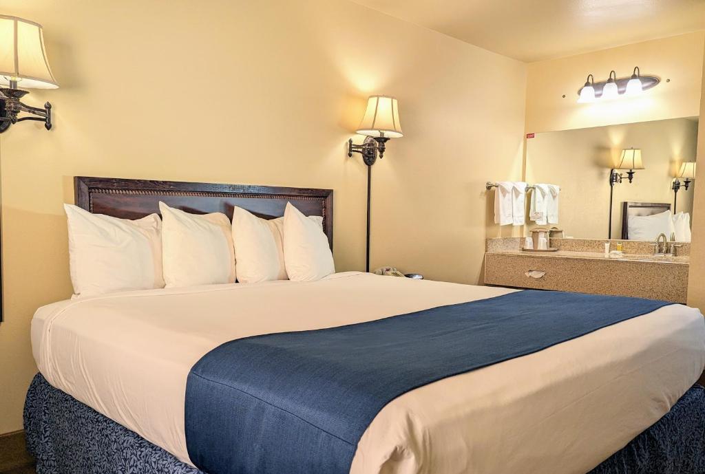 Postel nebo postele na pokoji v ubytování First Gold Gaming Resort