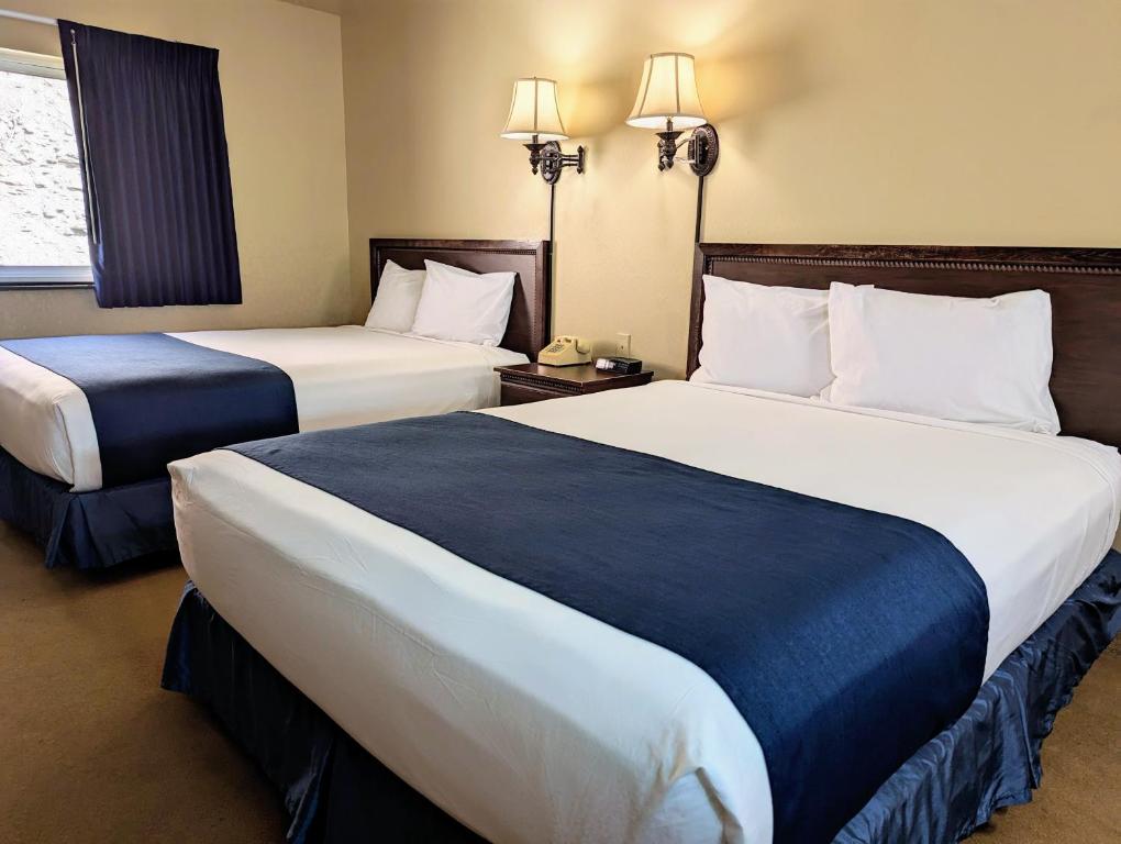 Postel nebo postele na pokoji v ubytování First Gold Gaming Resort