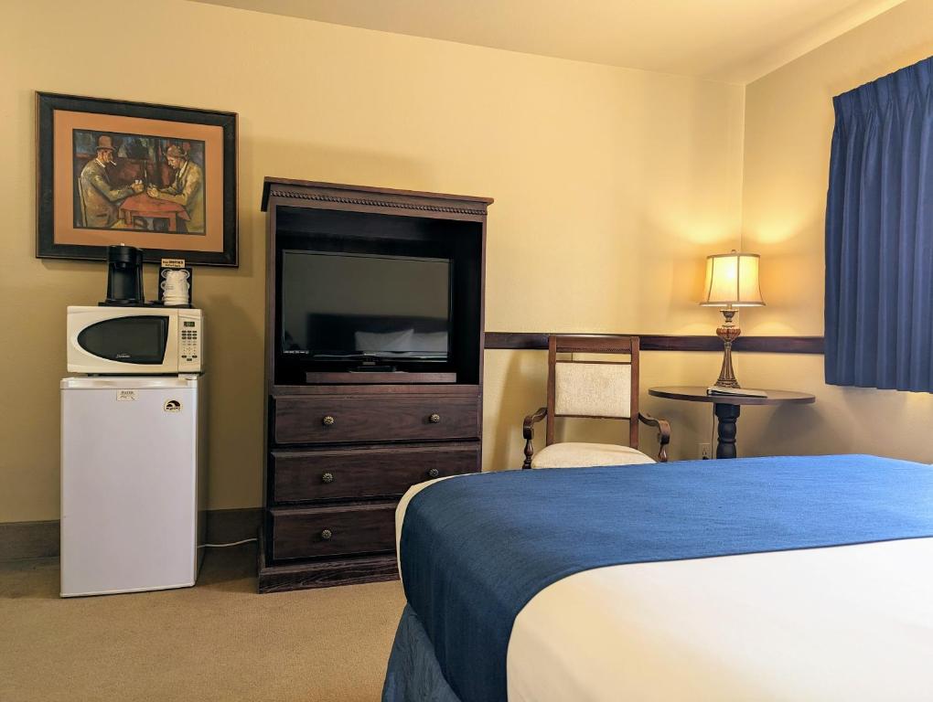 Postel nebo postele na pokoji v ubytování First Gold Gaming Resort