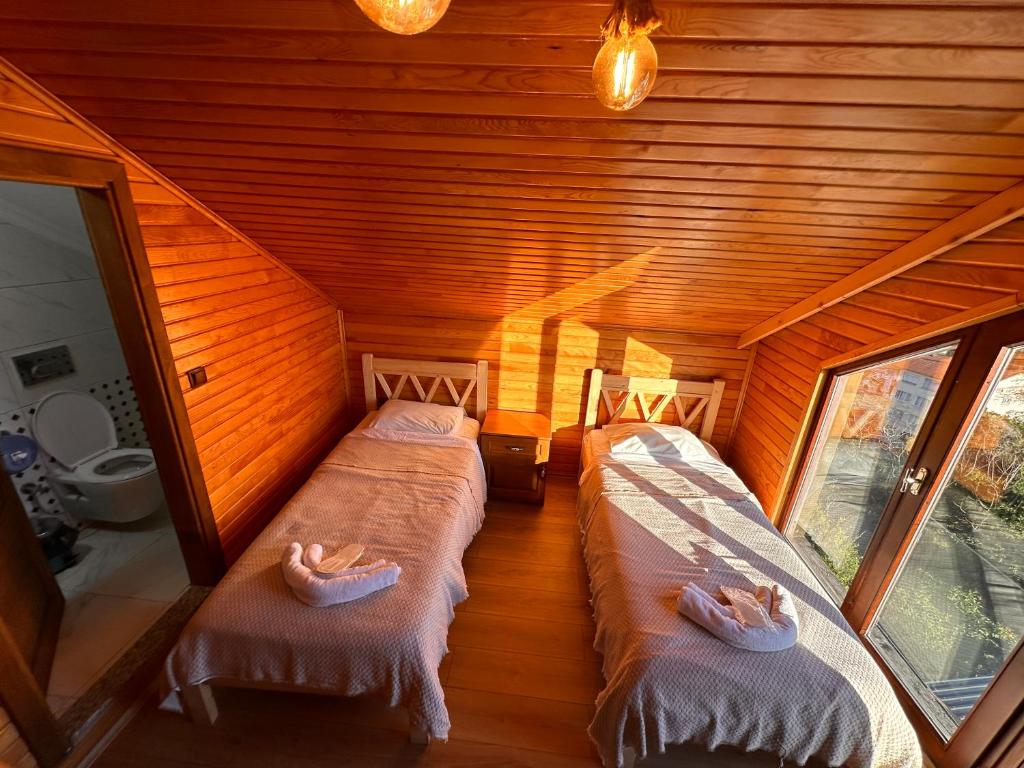 Postel nebo postele na pokoji v ubytování Falez Cafe&Restaurant&Pansiyon-Arhavi