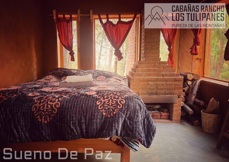 Ένα ή περισσότερα κρεβάτια σε δωμάτιο στο Cabanas Rancho Los Tulipanes - dream of peace