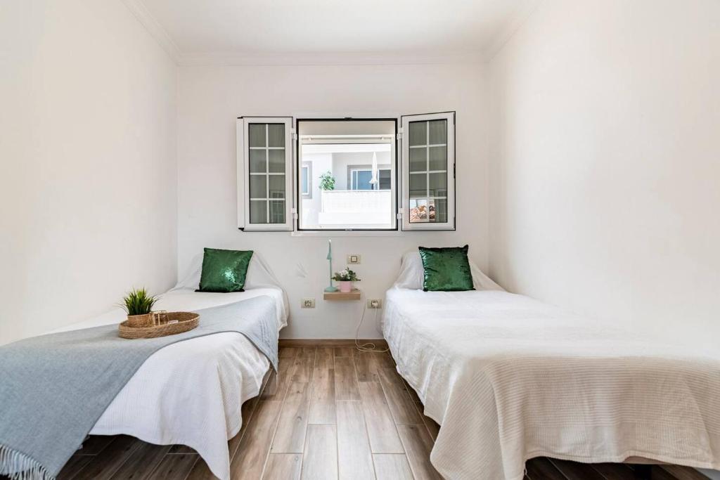 Łóżko lub łóżka w pokoju w obiekcie Villa Aspen Gran Canaria
