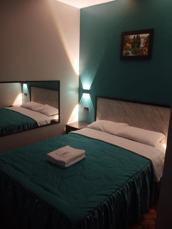 Postel nebo postele na pokoji v ubytování Hostal El Pilar