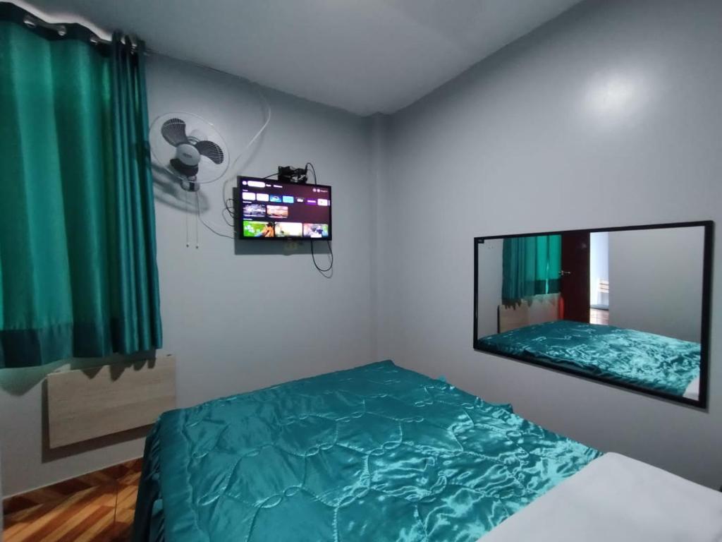 Postel nebo postele na pokoji v ubytování Hostal El Pilar
