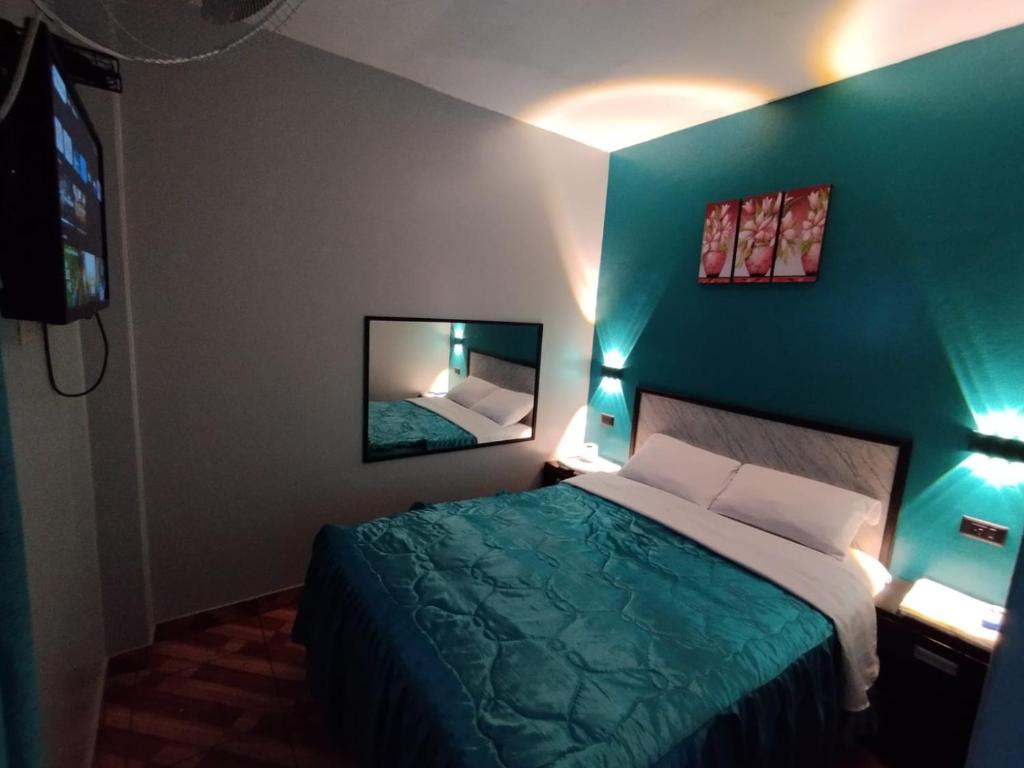 Postel nebo postele na pokoji v ubytování Hostal El Pilar