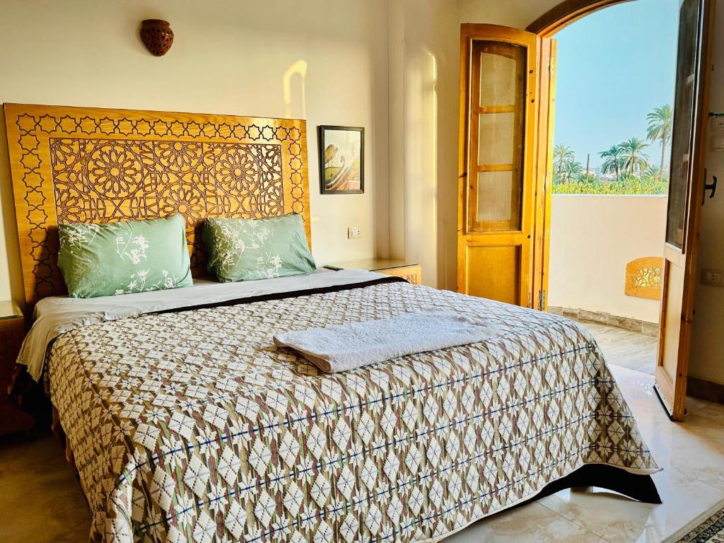 Postel nebo postele na pokoji v ubytování Dar Lina Guesthouse Luxor