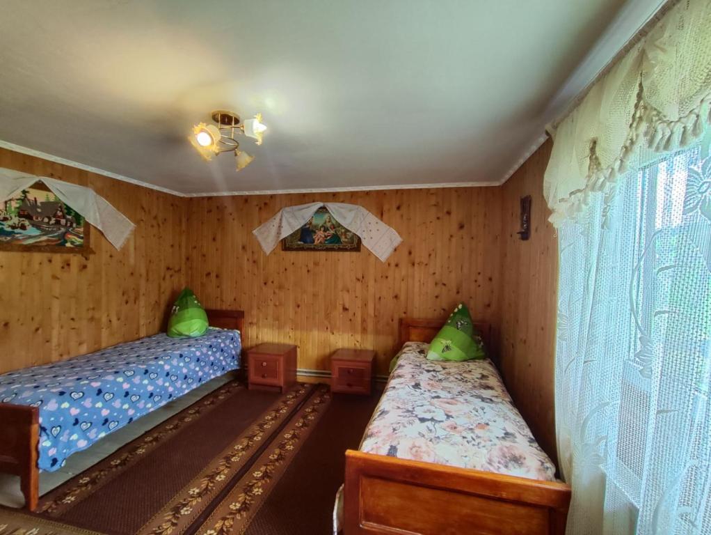 Postel nebo postele na pokoji v ubytování У Василини