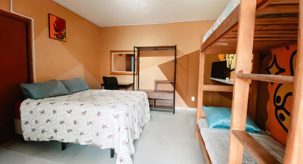 Postel nebo postele na pokoji v ubytování Sagui Hostel