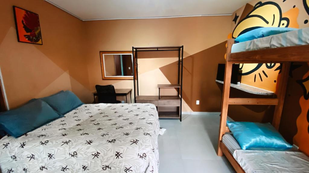 Postel nebo postele na pokoji v ubytování Sagui Hostel
