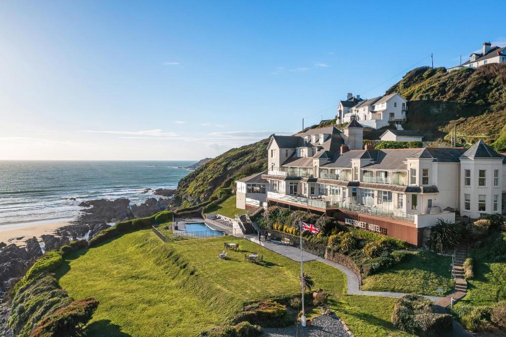 an aerial view of a house on a cliff next to the ocean at Watersmeet Hotel in Woolacombe