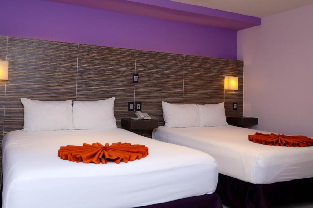 Postel nebo postele na pokoji v ubytování Hotel Kavia