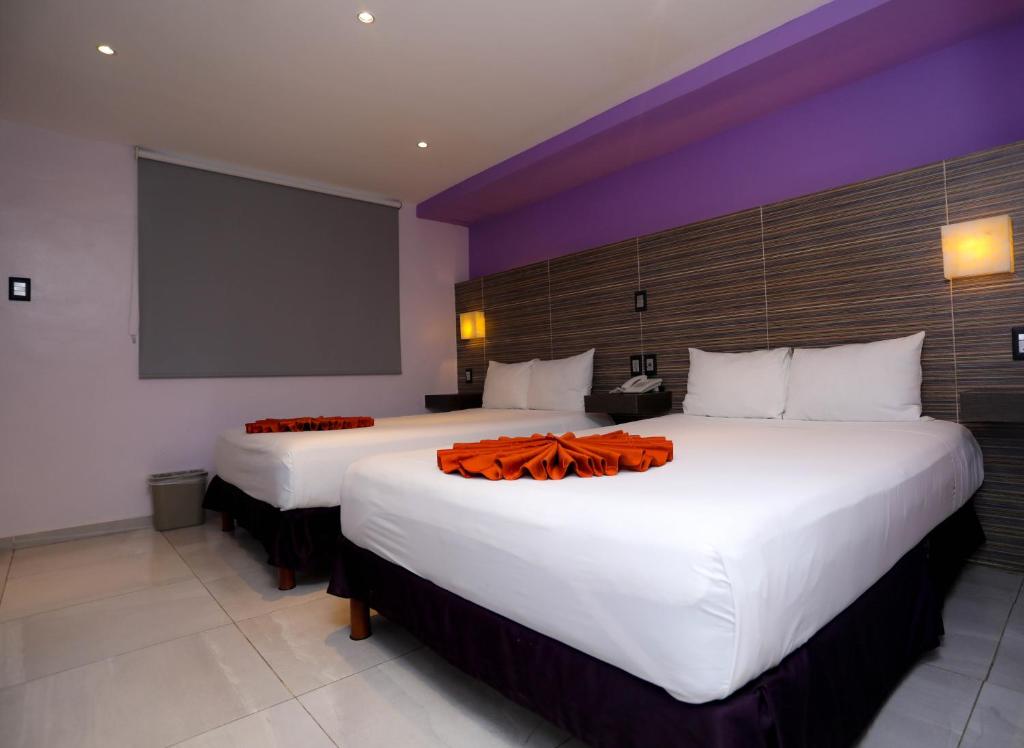 Postel nebo postele na pokoji v ubytování Hotel Kavia