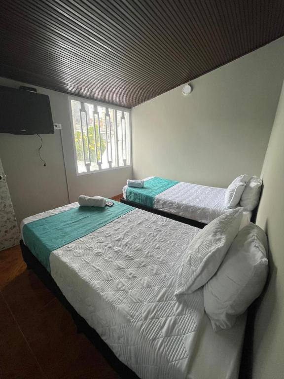 Postel nebo postele na pokoji v ubytování HOTEL LUXEM
