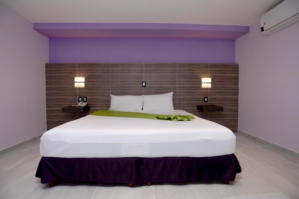 Postel nebo postele na pokoji v ubytování Hotel Kavia
