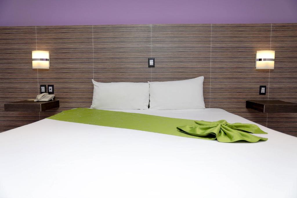Postel nebo postele na pokoji v ubytování Hotel Kavia