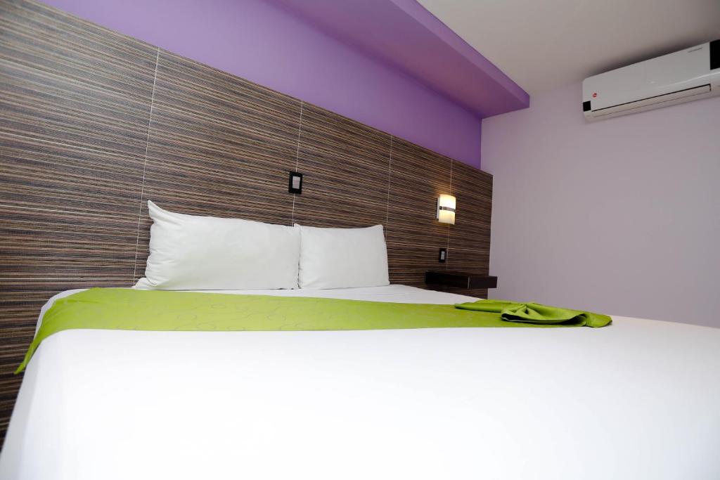 Postel nebo postele na pokoji v ubytování Hotel Kavia