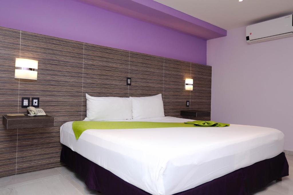 Postel nebo postele na pokoji v ubytování Hotel Kavia