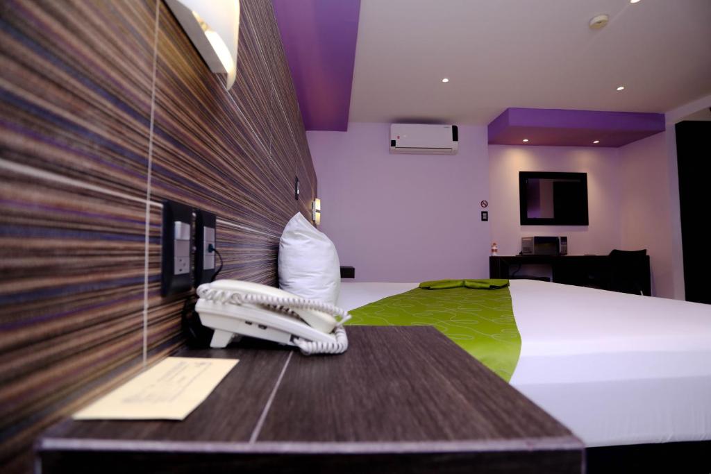 Postel nebo postele na pokoji v ubytování Hotel Kavia