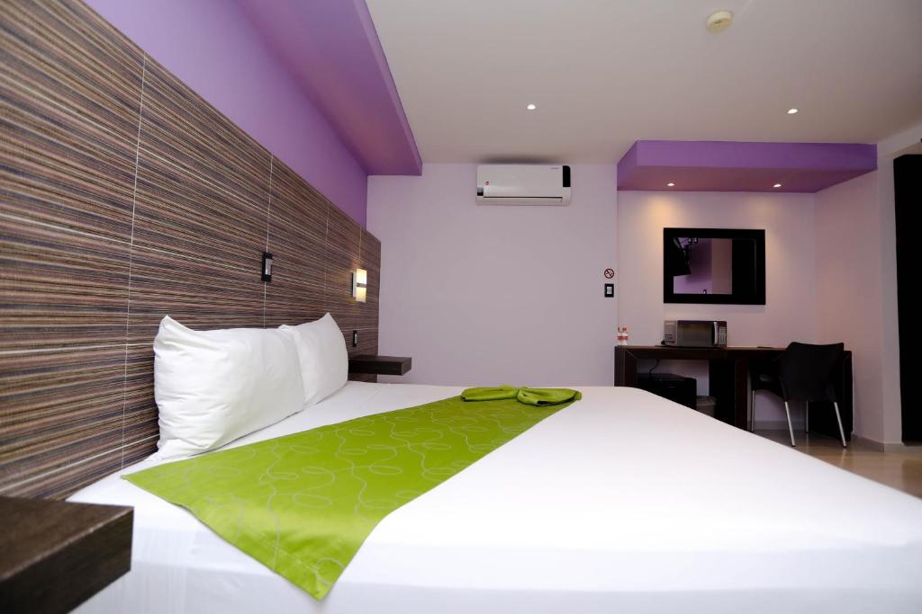 Postel nebo postele na pokoji v ubytování Hotel Kavia