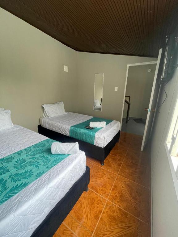 Postel nebo postele na pokoji v ubytování HOTEL LUXEM