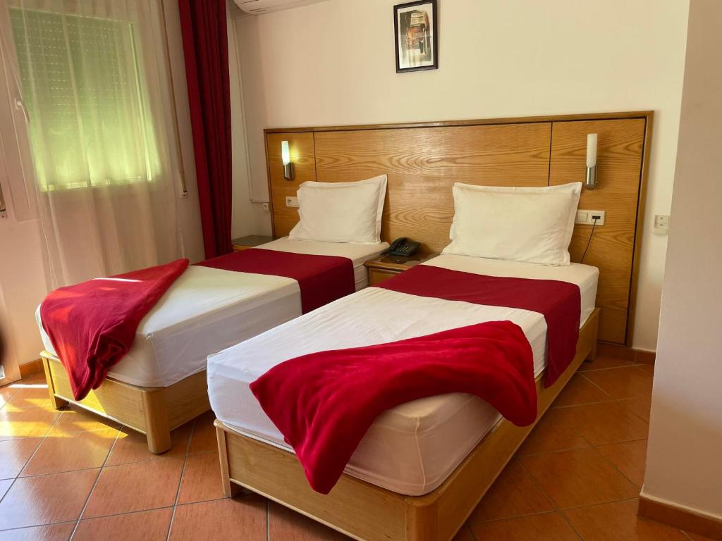 Postel nebo postele na pokoji v ubytování Sary's Hotel