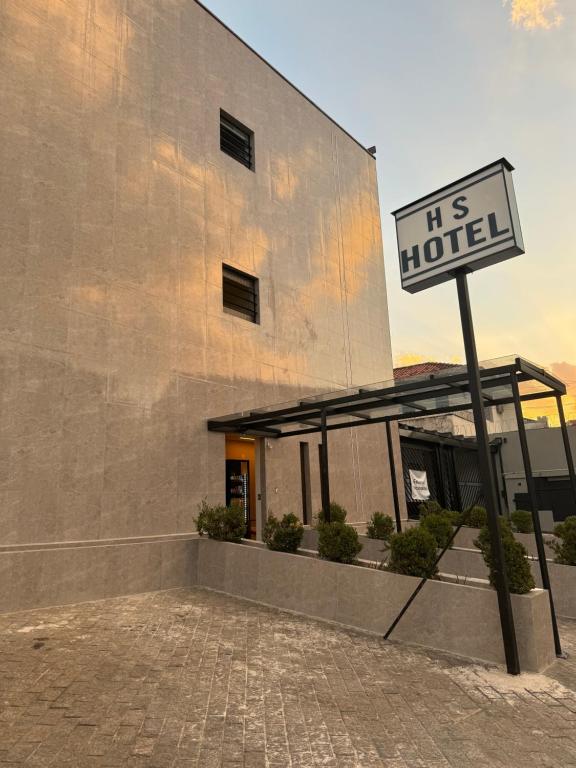 a sign in front of a building with a us hotel at HS Hotel in Sao Paulo