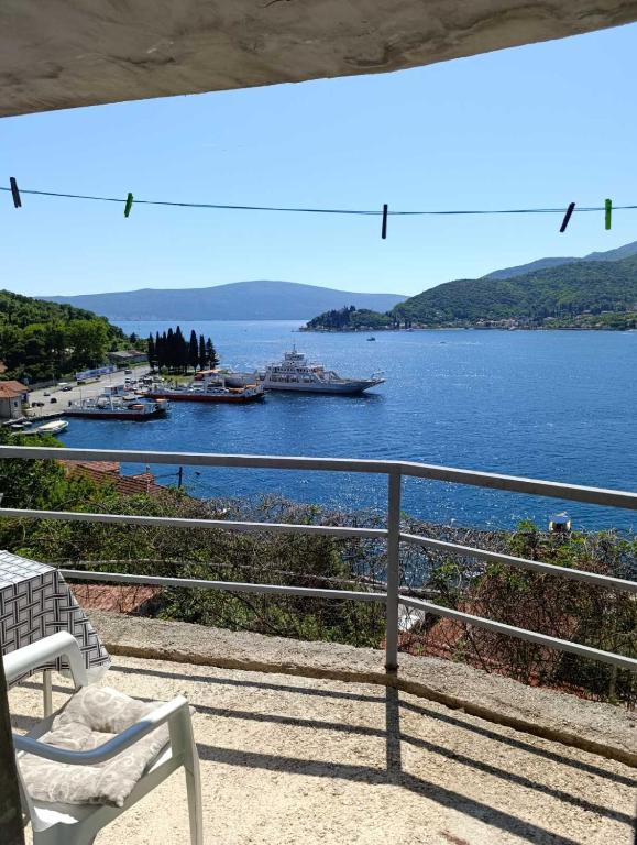 a balcony with a view of a large body of water at Apartments Eftimov in Tivat