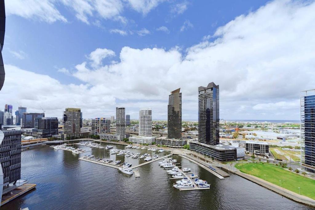 a view of a city with boats in the water at Brilliant Victoria Harbour Waterfront in Melbourne