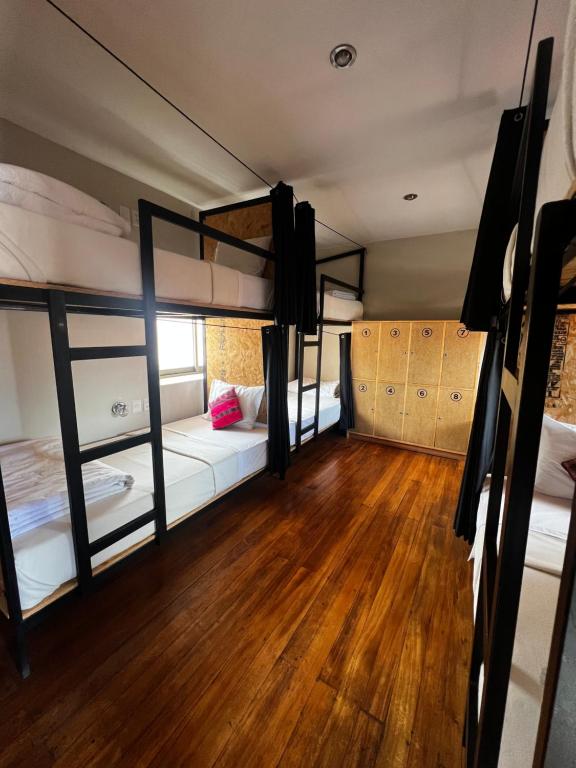 Ένα ή περισσότερα κρεβάτια σε δωμάτιο στο Xplora Hostel Cusco