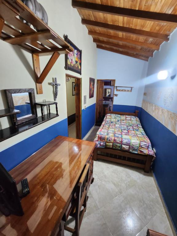 Postel nebo postele na pokoji v ubytování Hotel Atenas Jericó