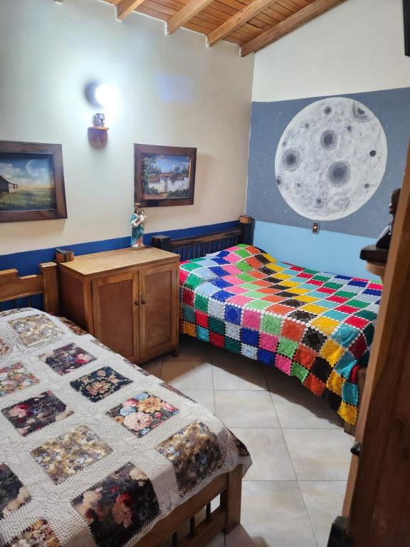 Postel nebo postele na pokoji v ubytování Hotel Atenas Jericó