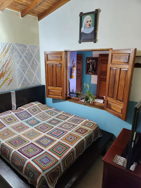 Postel nebo postele na pokoji v ubytování Hotel Atenas Jericó