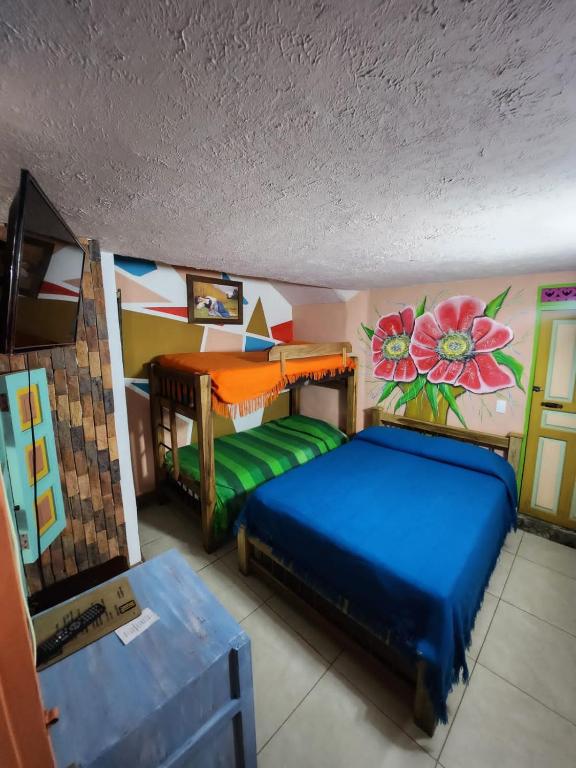 Postel nebo postele na pokoji v ubytování Hotel Atenas Jericó