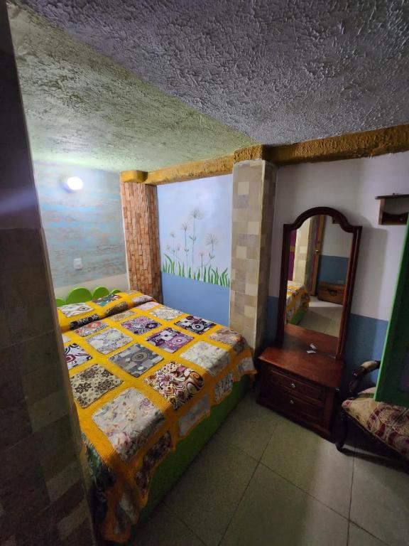 Postel nebo postele na pokoji v ubytování Hotel Atenas Jericó